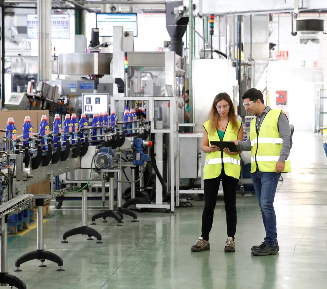 Two employees working in production 