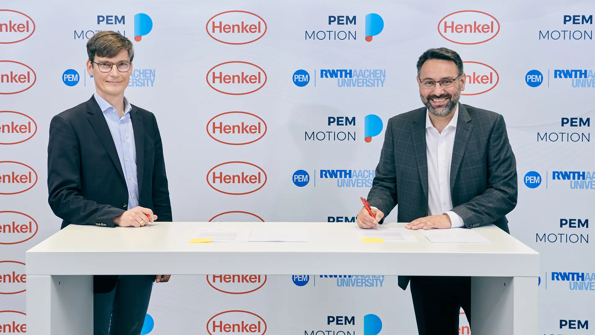 Professor Achim Kampker, Chair Holder and Partner at PEM (left), and George Kazantzis, Corporate Vice President Adhesive Technologies, Automotive Components, Henkel (right)