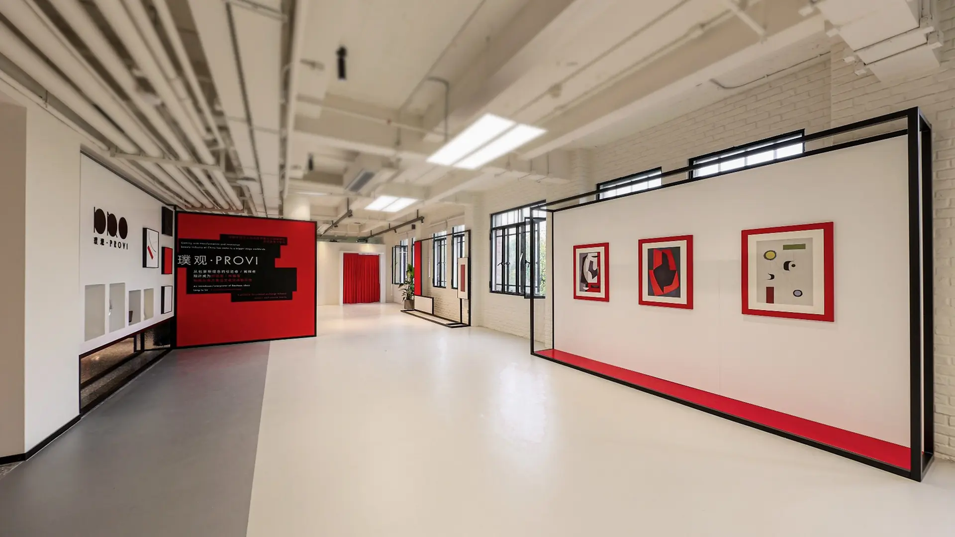Entrance of PROVI in Shanghai with white and red walls and arts