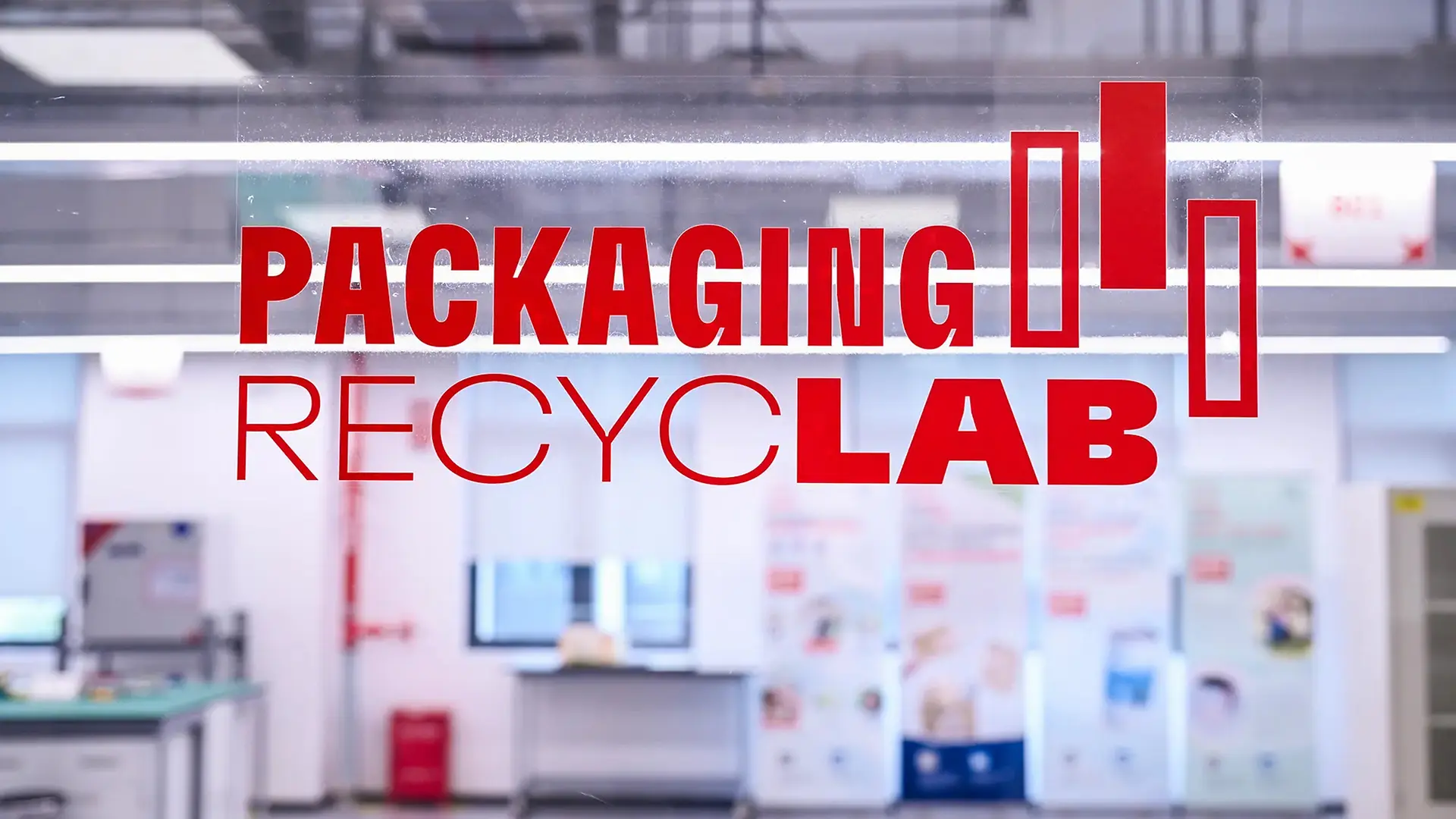 Red texts of packaging recyclab with lab view in the background